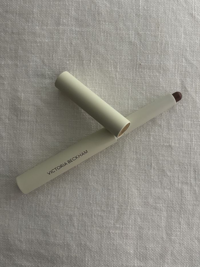 Victoria Beckham contour stylus on white linen background